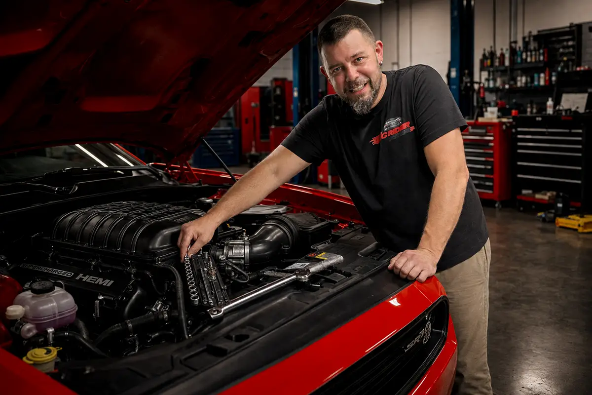 Red Challenger being serviced inside the MCRIDER MOTORS workshop