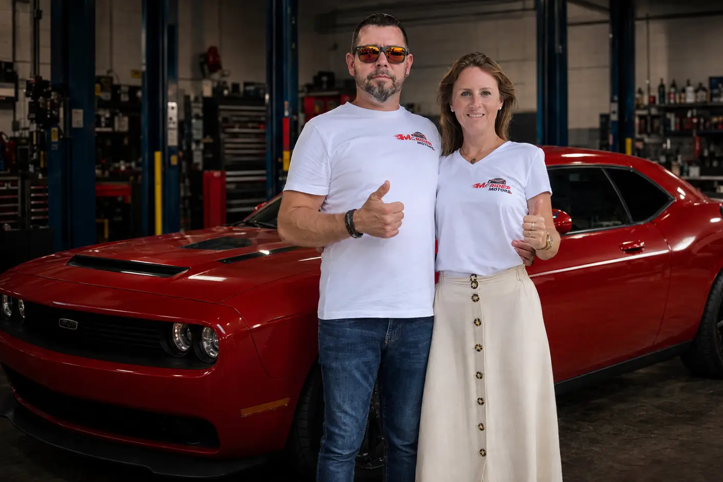 Marcus and Bettina Reiter standing in the MCRIDER MOTORS workshop